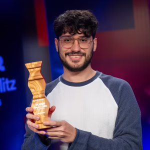 GM Alireza Firouzja holding Super Rapid & Blitz Croatia 2026 Champion Trophy.